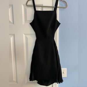 Little Black Dress - cut out with a flare skirt, high neck, and open back